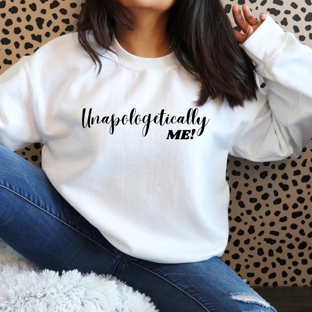 a woman wearing a white sweatshirt that says unspectably met