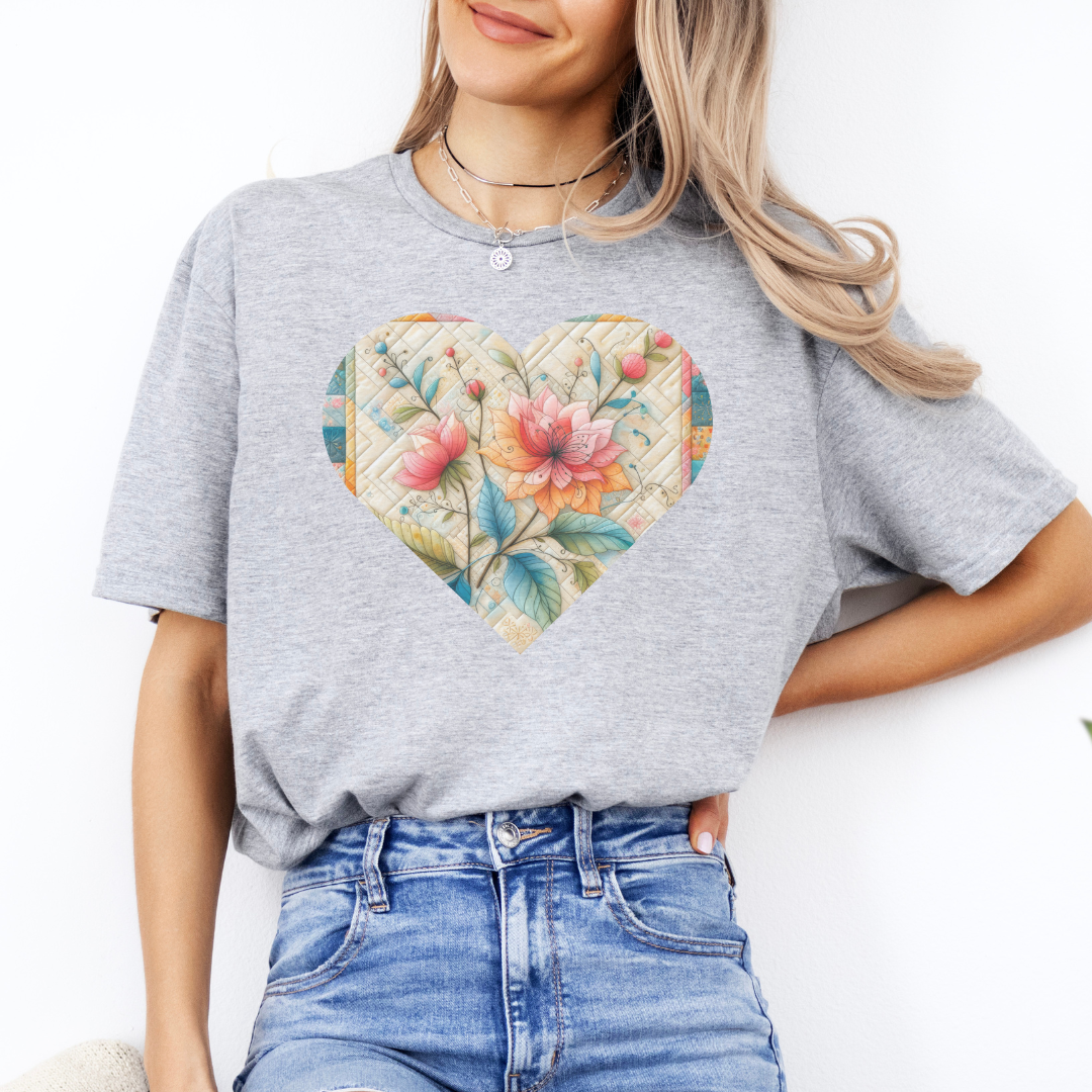 a woman wearing a t - shirt with a floral heart on it