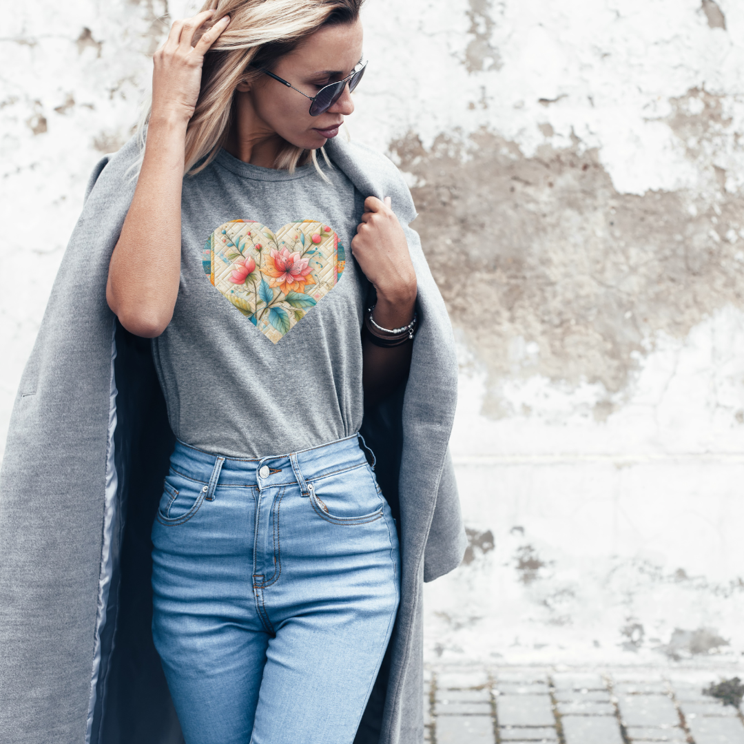a woman in jeans and a t - shirt with a heart on it